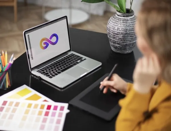 Creative laptop workspace showing 2025 graphic design trends for branding and visuals