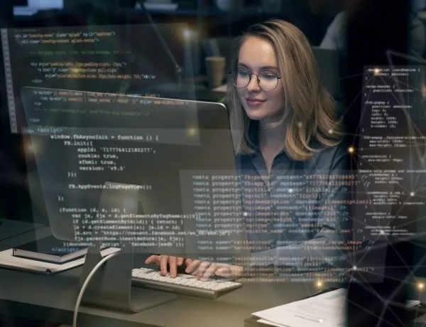 Woman coding on computer symbolizing best web development company selection process